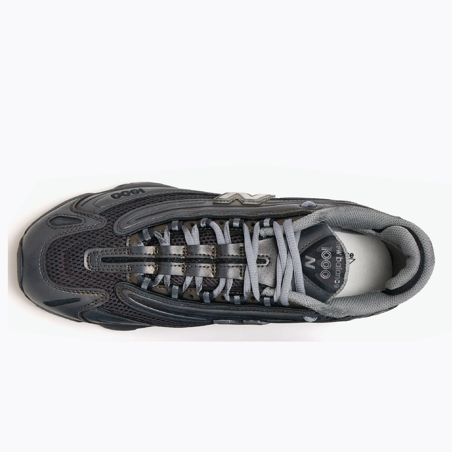 New Balance 1000 sneaker in a black colorway with metallic silver accents.