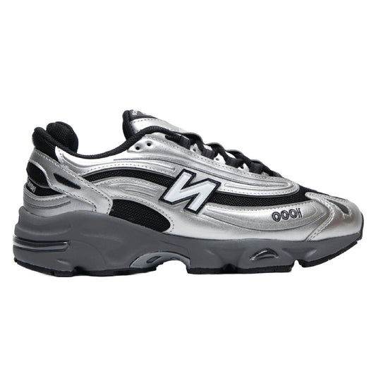 New Balance 1000 sneaker in a silver metallic and black colorway.