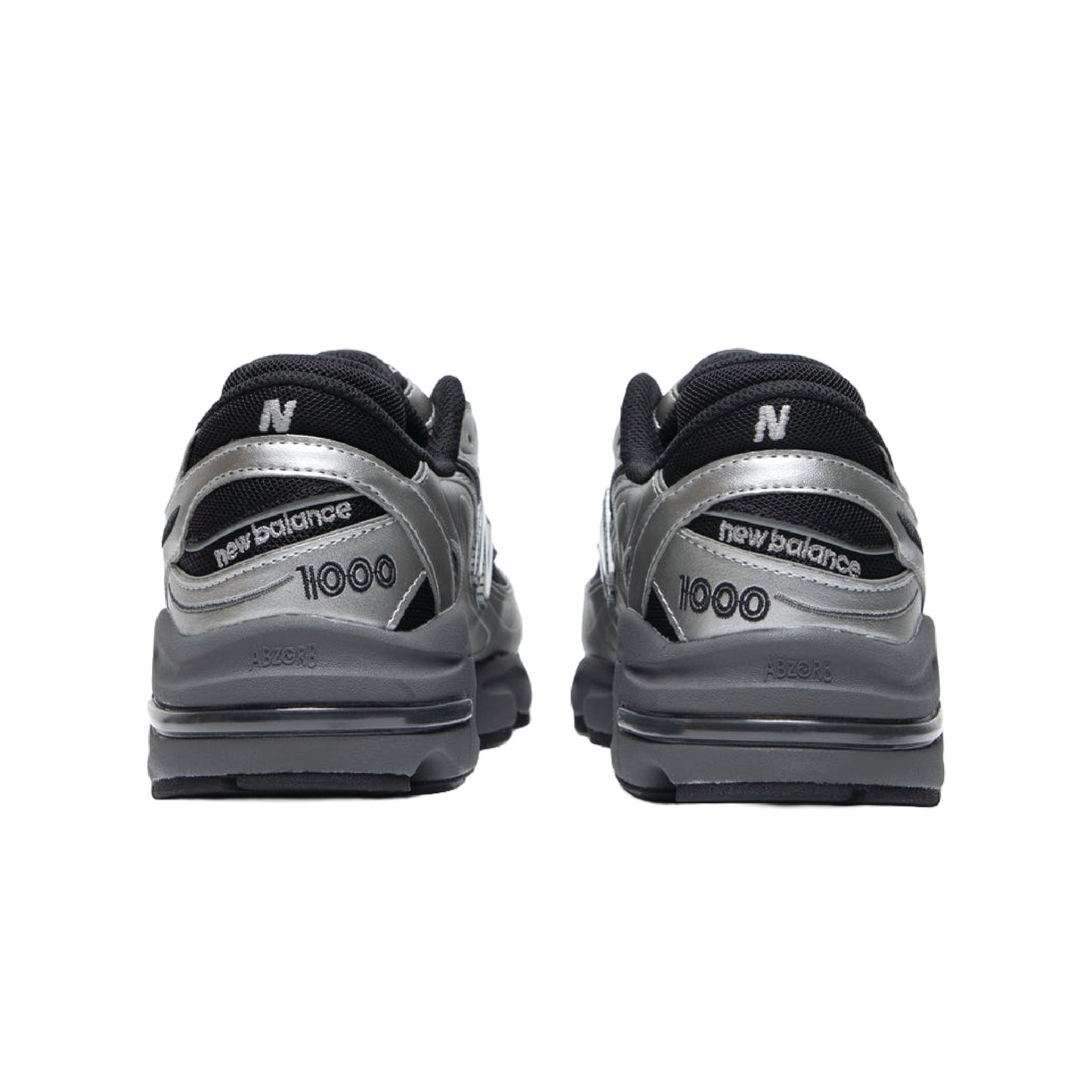 New Balance 1000 sneaker in a silver metallic and black colorway.